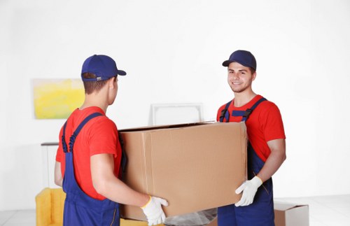 Packed boxes and furniture prepared for removal truck hire