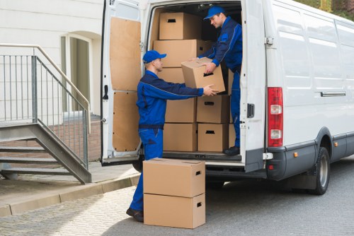 Professional movers handling boxes and furniture for Harold Hill customers