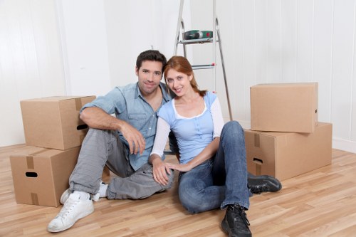 Local team handling furniture collection with access challenges