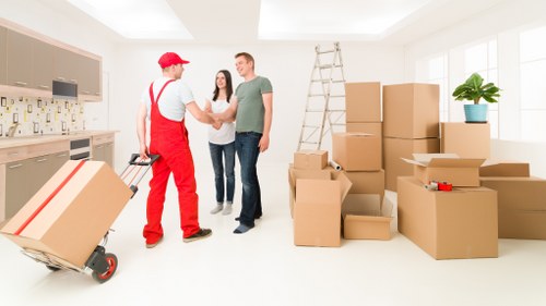 Household items and boxes being transported by a man with a van