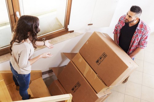 Furniture being carefully carried from a property during a move