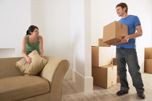 Packed boxes and furniture prepared for a residential relocation in Harold Hill