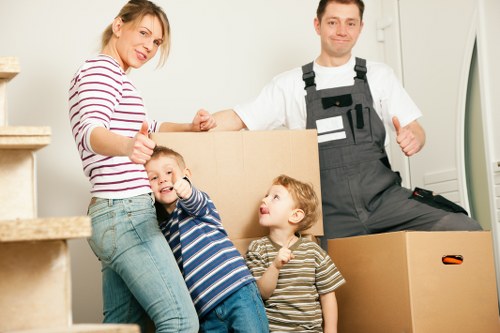 Packed moving boxes and furniture ready for loading